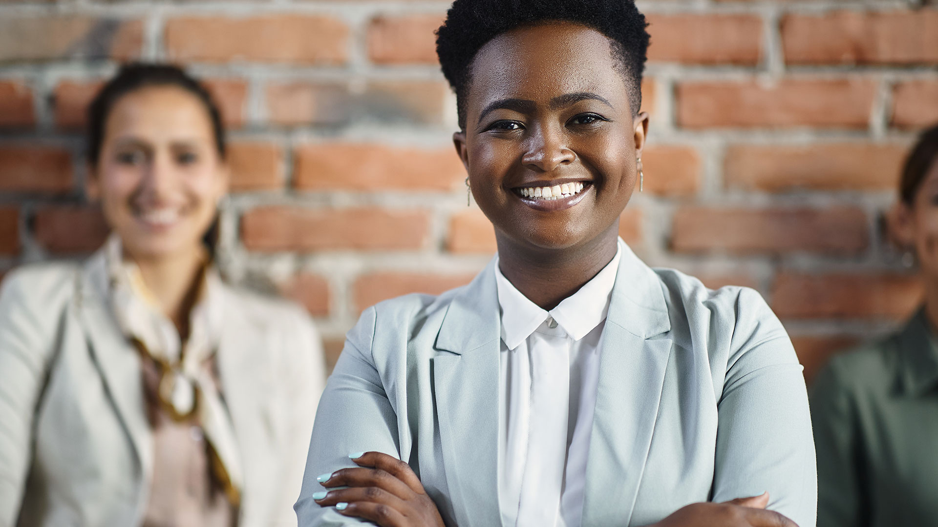 Business Team Smiling facing front in suit